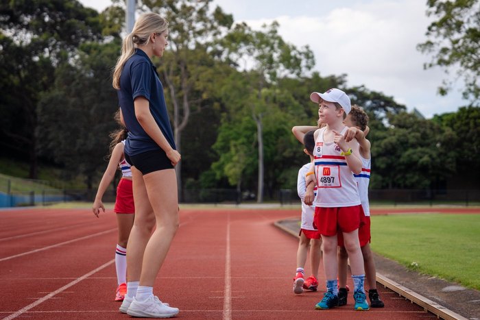 An age group being led trackside at ES Marks