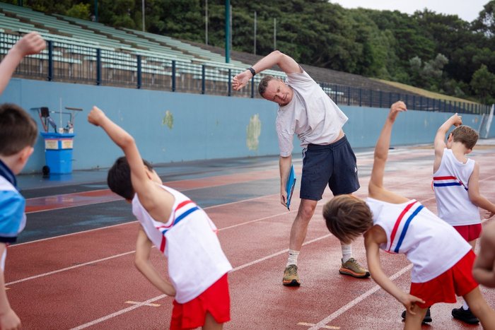 Athletes practising relay baton changes at ES Marks