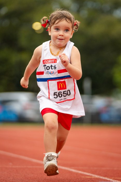 A Tiny Tot in full ESLAC uniform with number and age patch