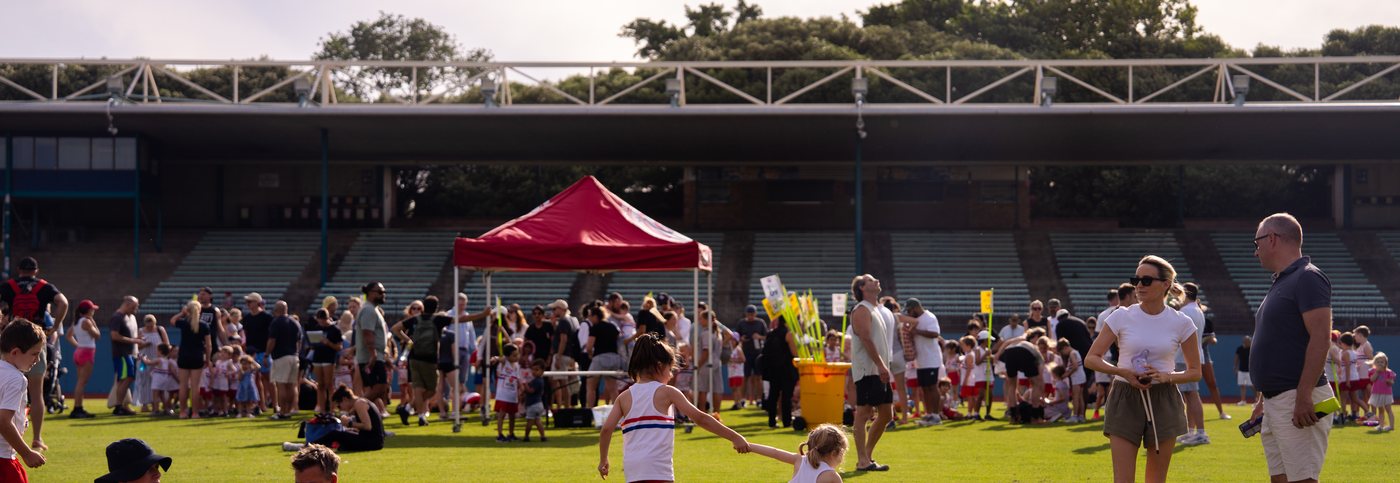 Athletes and families gathered at ES Marks Athletics Field on a Friday night